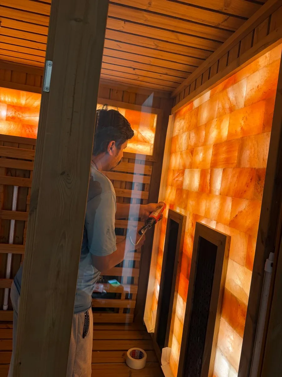 Sealing the Himalayan salt wall during the Project 01 build in Dubai