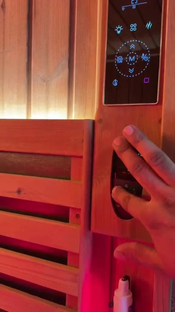 Digital sauna control panel mounted on the timber wall of Project 01